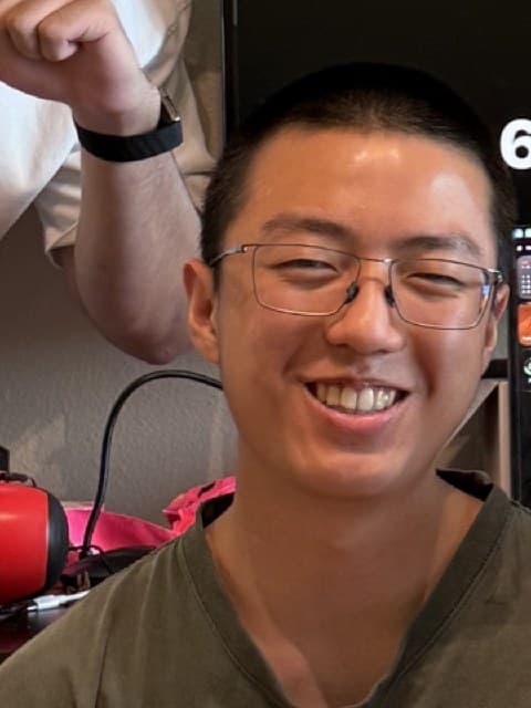 An OpenTrade team member laughing at a desk